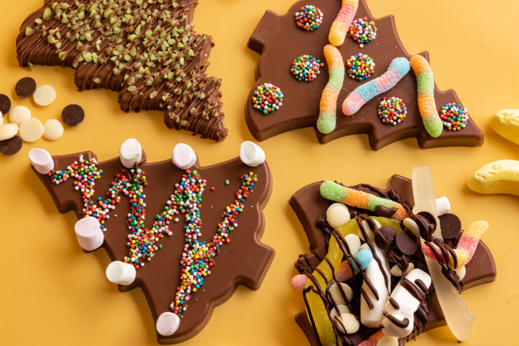 visit the chocolateries for deck the Christmas tree experience in December 2026