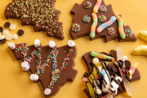 visit the chocolateries for deck the Christmas tree experience in December 2026